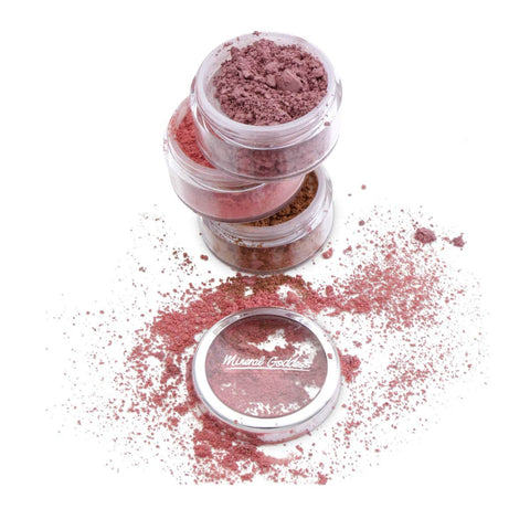 Three small jars of loose mineral goddess blush powder with label on a white background.