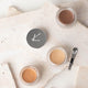 3 colours of mineral goddess luxury cream foundation on a stone background with a metal scoop.