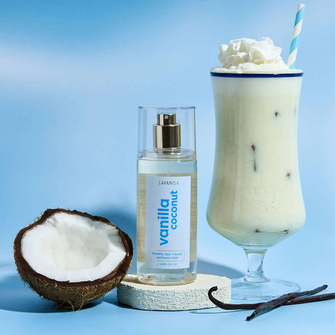 Lavanila Vanilla Coconut 150ml perfume product with a glass of vanilla shake & coconut on a blue background.