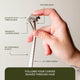 Hand holding a safety razor with labeled features on a neutral background