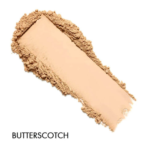 Butterscotch-colored makeup swatch on a white background
