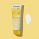 Little Urchin Kids natural clear zinc sunscreen tube on a yellow background.