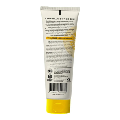 The back of a white squeeze tube of kids sunscreen with a yellow cap, showing product details, ingredients, and a barcode on a white background.