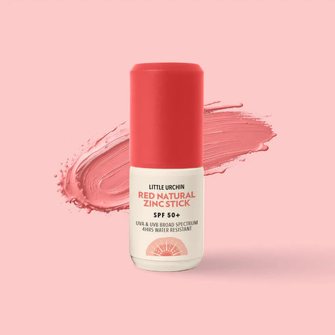 Little Urchin Red Natural Zinc Stick SPF 50+ sunscreen stick with a coral red cap and white label, set against a matching coral pink background with a textured product swatch behind it.