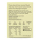 Back of a chewy almond butter caramel package showing product description, ingredients, nutrition facts, and certification logos on a light beige background.