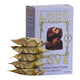 Stack of Loco Love hazelnut butter pralines with packaging on a white background