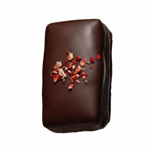 Whole strawberry vanilla burst chocolate with freeze dried strawberry sprinkle. 
