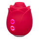 Red rose shaped sex toy with buttons lit up. 