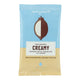 Organic, fair trade, vegan and gluten free coconut chocolate shown in its packet.
