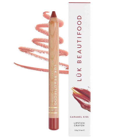 A neutral rose brown lipstick crayon, placed on a swatch of its color and texture, next to its packaging.