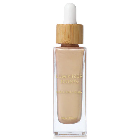 A pale, luminious pearl liquid highlighter packaged in its glass dropper bottle.