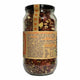A glass jar of Mindful Foods Kombucha with a black lid and a tan paper label featuring orange text and heart graphics, set against a plain white background.