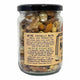 A clear glass jar filled with mixed nuts and seeds, sealed with a black lid and covered by a tan paper label. The label reads 'Mindful Foods' and 'Organic Mixed Nuts'.