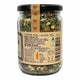 A clear glass jar of herbal tea with a black lid and a tan paper label, shown on a white background. The label reads 'CAFFEINE FREE | GLUTEN FREE' and features a vertical strip of orange hearts on the lid.