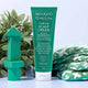 MooGoo Cradle Cap Scalp Cream with green packaging and text on a light blue background.