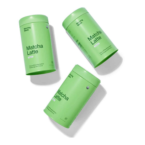 Three green containers labeled 'Matcha Latte' on a white background