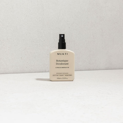 MUKTI Botanique Deodorant - Citrus & Siberian Fir 100ml spray bottle on a white surface. 