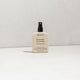 MUKTI Botanique Deodorant - Citrus & Siberian Fir 100ml spray bottle on a white surface. 