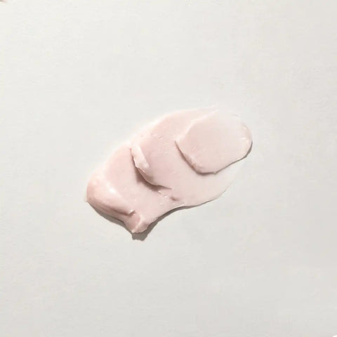 A black cosmetic jar of Mukti Queen of the Night Crème with a beige label, shown on a plain white background.