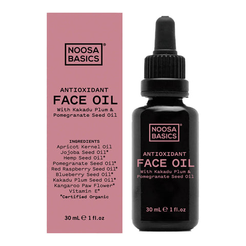 A dropper bottle of Noosa Basics' Antioxidant Face Oil with Kakadu plum and pomegranate seed oil next to its box.