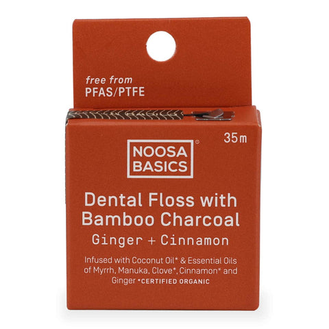 Front of Noosa Basics Dental Floss with Bamboo Charcoal - Ginger + Cinnamon flavour. Cinnamon coloured packaging.