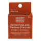 Front of Noosa Basics Dental Floss with Bamboo Charcoal - Ginger + Cinnamon flavour. Cinnamon coloured packaging.