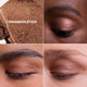 Close-up of cinnamon stick eyeshadow on skin with swatch and close-up of eye.