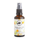A 50ml spray bottle of Perfect Lotions 'Happy and calm' aromatic mist, featuring an amber glass bottle, black spray nozzle, and a white label with orange and yellow citrus illustrations.