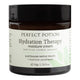 A 50g jar of Perfect Potion Hydration Therapy moisture cream, featuring a dark amber glass container, a black lid, and a white label with green accents.