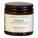 A 50g jar of Perfect Potion Replenish ultra-rich moisture cream, featuring an amber glass jar with a black screw-on lid and a cream-colored label.