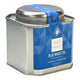 A square silver metal tin of Tea Tonic Blue Magic Tea with a blue geometric label and a blue seal on the lid, set against a plain white background. Naturally caffeine free loose leaf tea.