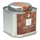 A square silver metal tea tin with a matching lid, featuring a brown geometric pattern label for Tea Tonic Chocolate Chai Tea on a white background. Contains caffeine.