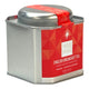 A square silver metal tea tin with a red geometric label reading 'Tea Tonic English Breakfast Tea' on a white background. Smooth & true to good taste. Loose leaf tea.