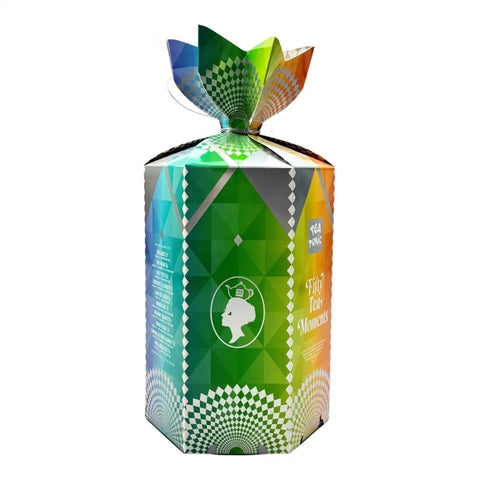A tall, hexagonal tea gift box with a colourful geometric design, featuring a green center, blue and orange side panels, and a patterned top bow, shown on a plain white background.