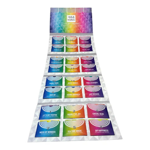 A long card of colorful tea bags laid out on a white background. The sheet has a rainbow gradient header and multiple small square pockets.