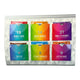 Six colourful tea bags arranged in a card with a geometric patterned border. Each packet has a different bright color and white text.