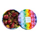 An open round tin of loose-leaf tea with a colorful geometric pattern lid. The left side shows dark red rosebud tea leaves, and the right side shows the lid.