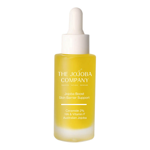 Yellow coloured skincare dropper bottle from 'The Jojoba Company' on a white background.