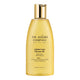 A 200ml bottle of The Jojoba Company Jojoba Luxe Shower Oil, featuring a translucent golden-yellow body and a metallic gold cap, set against a plain white background.