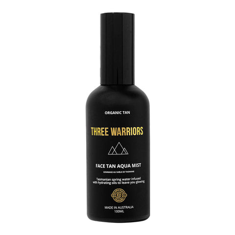 Three Warriors Face Tan Aqua Mist, an organic, vegan and cruelty-free face tan water made from natural ingredients shown in its black bottle.