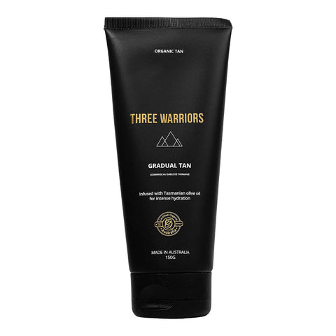 Three Warriors Gradual Tan, an organic, vegan and cruelty-free self-tanner made from natural ingredients shown in its black tube.
