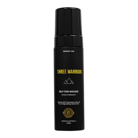 Three Warriors Self-Tan Mousse, an organic, vegan and cruelty-free gradual tanner made from natural ingredients shown in its black bottle with a foaming pump.