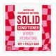 Solid Conditioner Hyper Hydrating bar packaging, featuring a white box with red and pink checkered side panels and bold red and pink text.