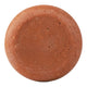 A round terracotta-coloured soap bar with a textured surface, isolated on a white background.