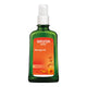 Weleda Arnica Massage Oil 100ml bottle with green body & orange label on a white background.