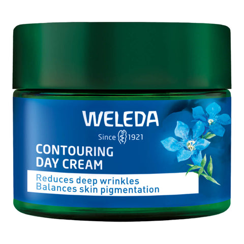 A jar of Weleda Contouring Day Cream with blue gentian and edelweiss, a hydrating, fast absorbing formula that reduces deep wrinkles, firms sagging neck and skin, and balances skin pigmentation.