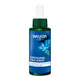 A dropper bottle of Weleda Contouring Face Serum with blue gentian and edelweiss, a highly efficacious, cell renewing, lightweight formula that reduces deep wrinkles, and firms, hydrates and nourishes the skin.