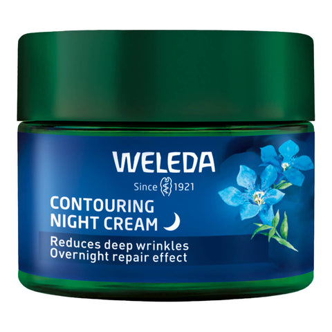 A jar of Weleda Contouring Night Cream with blue gentian and edelweiss, a regenerating, nourishing formula that reduces deep wrinkles, repairs skin overnight, and counteracts the effects of menopause on skin.