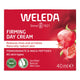 Weleda Firming Day Cream packaging with pomegranate illustration on a red background.