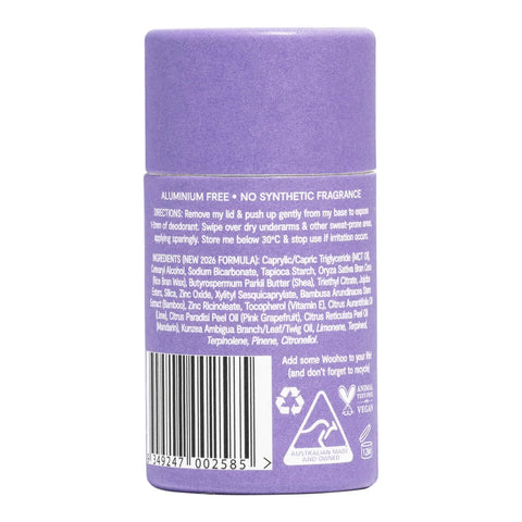A purple cylindrical deodorant stick shown from the back, featuring a white label with text, a barcode, and recycling symbols on a plain white background.
